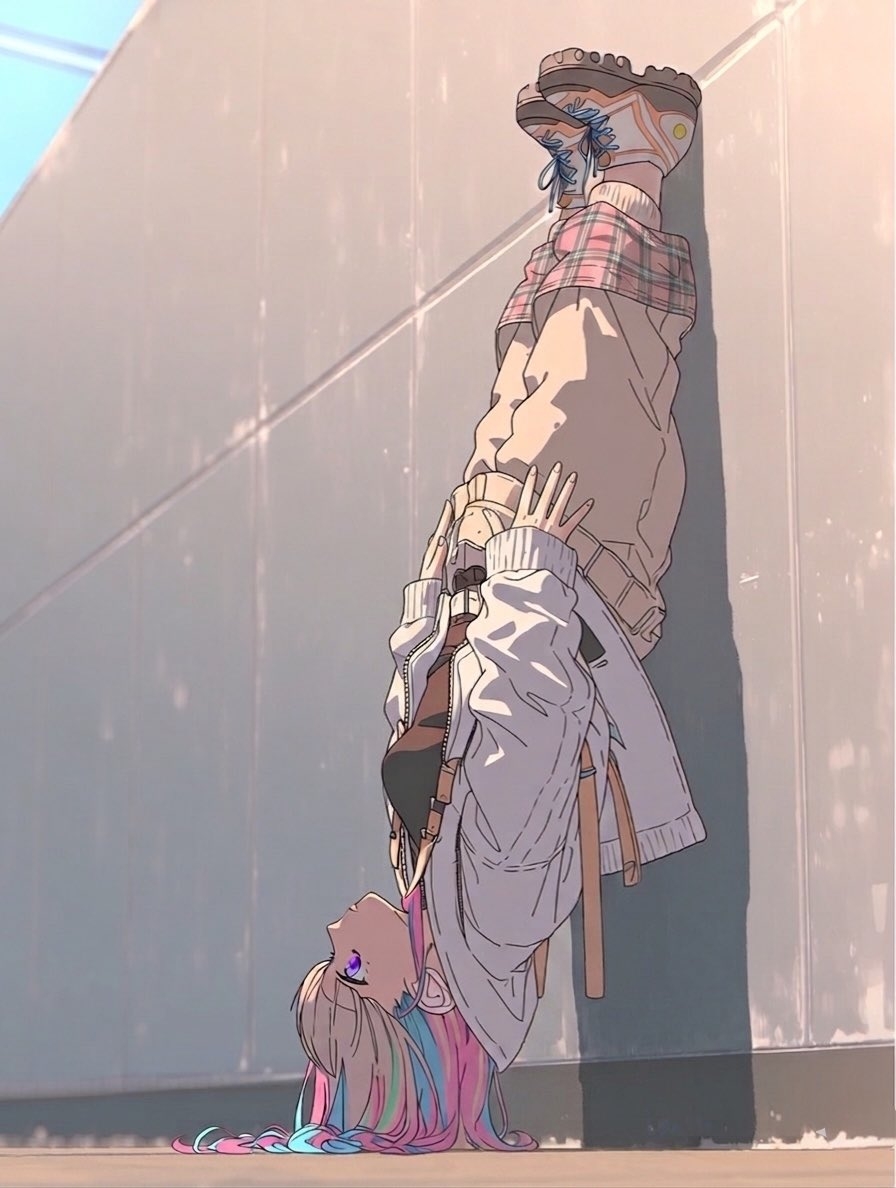 A long-haired girl is upside down against a glass wall, wearing a loose top and shorts