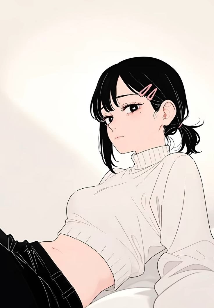 Black-haired woman in ivory cropped knit and black pants reclining